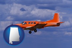 a red turboprop aircraft flying in a blue sky with cumulus clouds - with AL icon