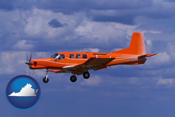 a red turboprop aircraft flying in a blue sky with cumulus clouds - with Virginia icon