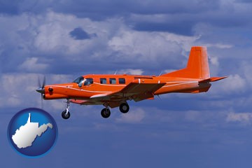 a red turboprop aircraft flying in a blue sky with cumulus clouds - with West Virginia icon