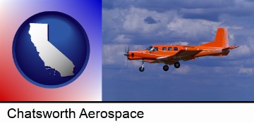 a red turboprop aircraft flying in a blue sky with cumulus clouds in Chatsworth, CA