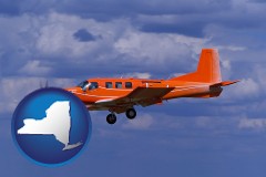 new-york map icon and a red turboprop aircraft flying in a blue sky with cumulus clouds