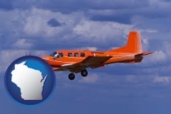 wisconsin map icon and a red turboprop aircraft flying in a blue sky with cumulus clouds
